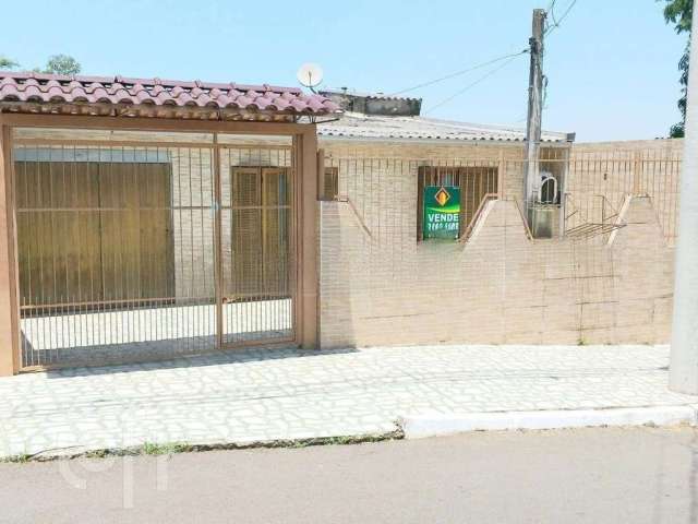 Casa em condomínio fechado com 3 quartos à venda na Avenida Dezessete de Abril, 8, Guajuviras, Canoas por R$ 290.000