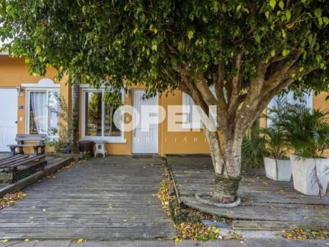 Casa em condomínio fechado com 3 quartos à venda na Rua Paes Lemes, 715, Rio Branco, Canoas por R$ 390.000