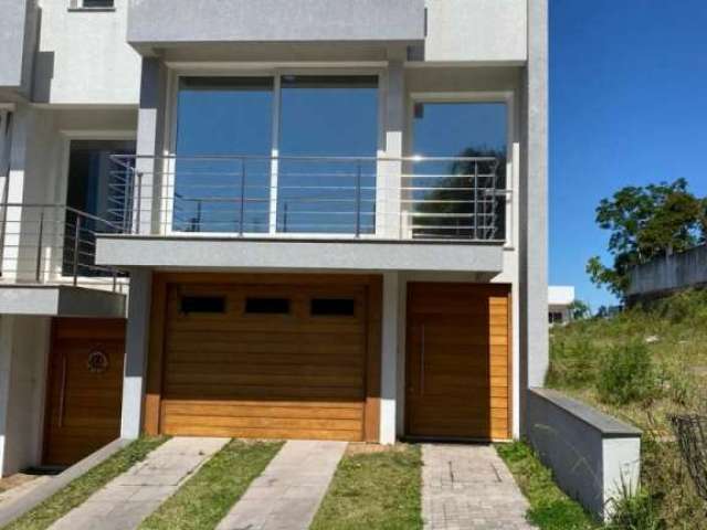 Casa em condomínio fechado com 3 quartos à venda na Rua Donario Neves da Silveira, 155, Mário Quintana, Porto Alegre por R$ 560.000