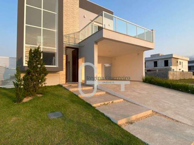 Casa com 4 dormitórios à venda, 184 m² por R$ 1.120.000,00 - Condomínio Flora Rica - Peruíbe/SP
