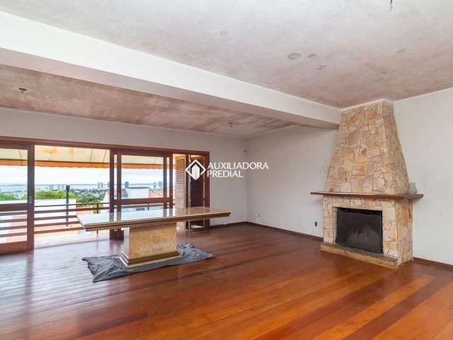 Casa em condomínio fechado com 4 quartos para alugar na Rua Alcebíades Antônio dos Santos, 169, Nonoai, Porto Alegre, 361 m2 por R$ 7.800