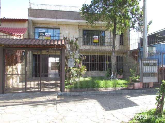 Casa comercial com 5 salas para alugar na Avenida Salvador Leão, 147, Sarandi, Porto Alegre por R$ 1.800