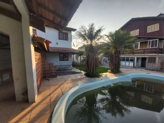 Casa com 4 quartos à venda na Thomaz Antônio Gonzaga, 464, Areal, Pelotas por R$ 955.000