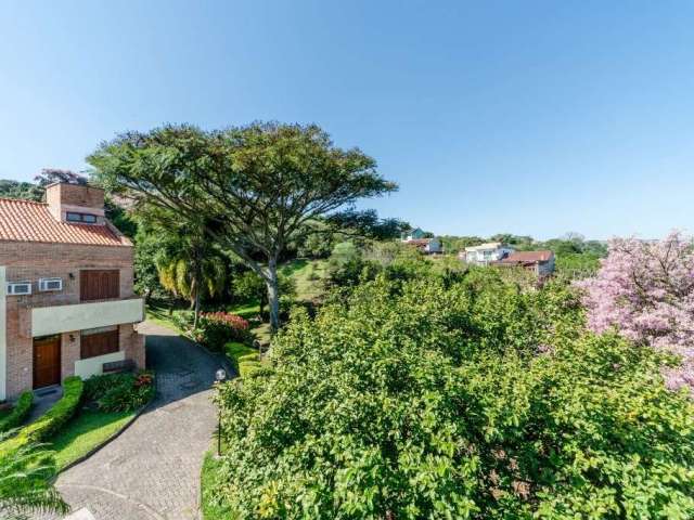 Casa em condomínio fechado com 3 quartos à venda na Avenida Vicente Monteggia, 2212, Cavalhada, Porto Alegre por R$ 450.000