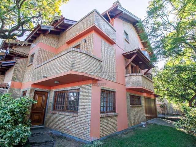 Casa com 4 quartos à venda na Avenida Guaíba, 10710, Ipanema, Porto Alegre por R$ 1.180.000