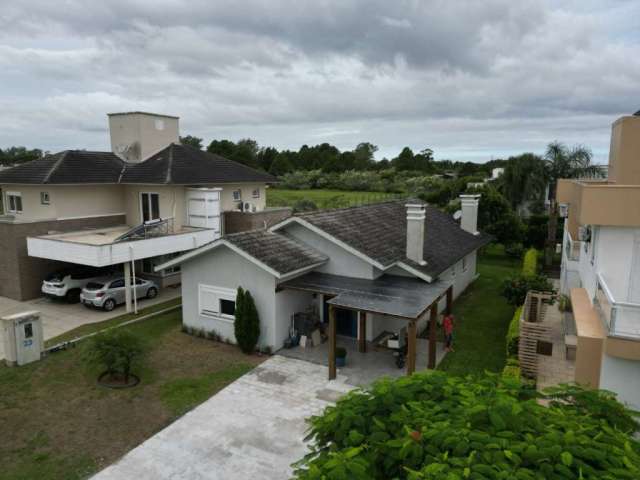 Casa em condomínio fechado com 4 quartos à venda na Da Lagoa, 1110, Farroupilha, Osório, 168 m2 por R$ 1.500.000