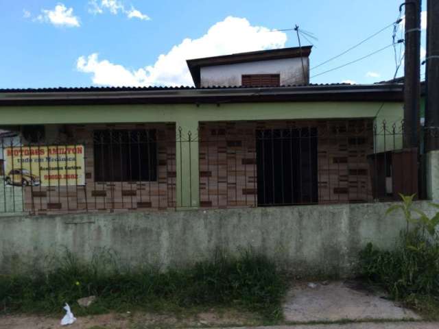 Casa á venda no bairro Tarumã em Viamão.&lt;BR&gt;&lt;BR&gt;Imóvel com dois dormitórios, duas salas, dois banheiros, cozinha, área de serviço, varanda, área na frente, despensa e uma oficina de 300m c