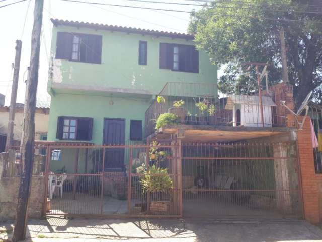 Casa á venda no bairro Lomba Tarumã em Viamão.&lt;BR&gt;Imóvel com sala, cozinha, quatro dormitórios, um banheiro, lavanderia, despensa, pátio e uma vaga de garagem coberta.&lt;BR&gt;Localizado m fren