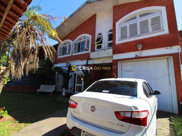 Casa com 4 quartos à venda na Rua Vicente Failace, 466, Tristeza, Porto Alegre por R$ 890.000
