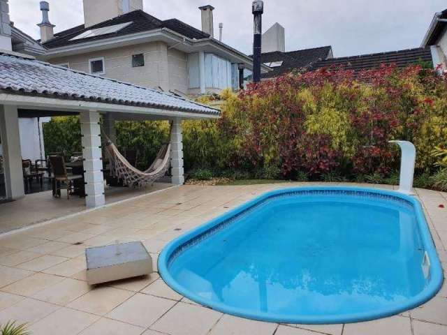 Casa em condomínio fechado com 3 quartos à venda no Cacupé, Florianópolis  por R$ 2.950.000