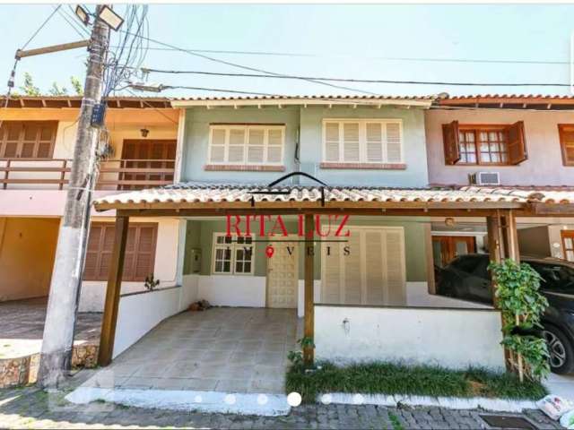 Casa em condomínio fechado com 3 quartos à venda na Avenida Juca Batista, 1492, Cavalhada, Porto Alegre por R$ 410.000