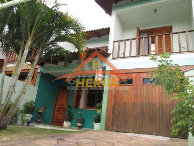 Casa com 3 quartos à venda na Rua Márcio Dias, 176, Nonoai, Porto Alegre por R$ 700.000