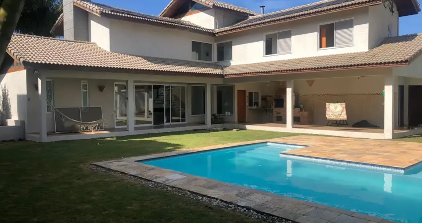 Casa espetacular no condomínio ecopark lagos, com 4 dormitórios sendo 2 suítes. conceito aberto, pé direito alto. possui 2 lotes. área gourmet fantástica com uma piscina ampla e glamourosa, com jard