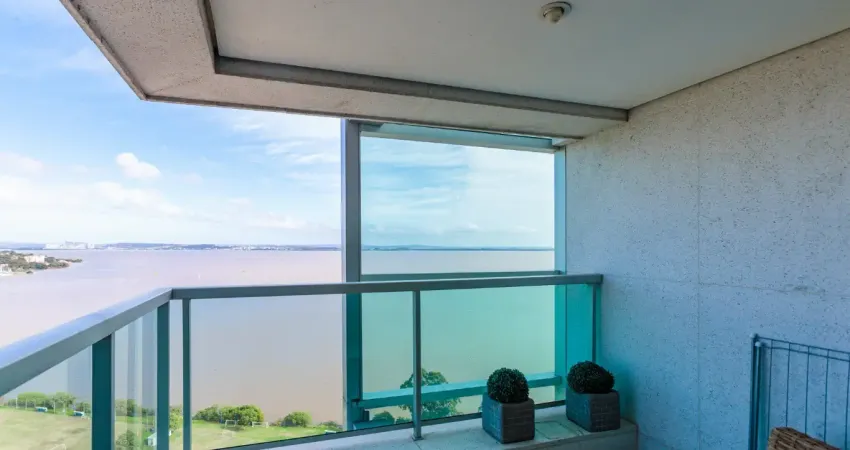 Loft com sacada living estar e jantar com cozinha americana.