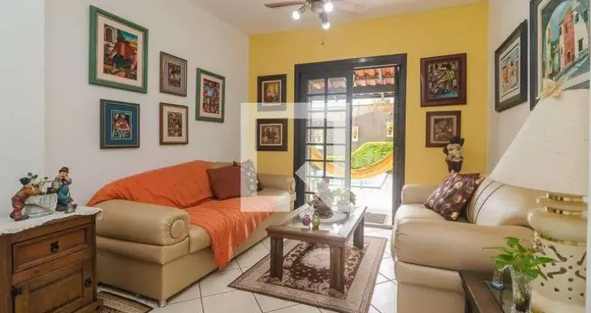 Casa com 3 quartos à venda na Rua Mário Assumpção, Guarujá, Porto Alegre