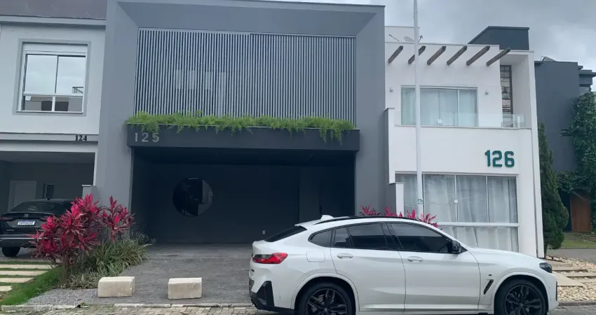 Belíssima casa em condomínio fechado no delta ville - biguaçú/sc.