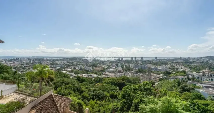Casa em condomínio fechado com 4 quartos à venda na Rua Alcebíades Antônio dos Santos, 379, Nonoai, Porto Alegre