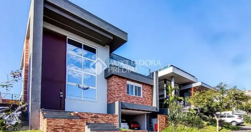 Casa em condomínio fechado com 3 quartos à venda na Estrada das Três Meninas, 1501, Vila Nova, Porto Alegre