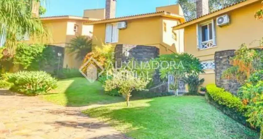 Casa em condomínio fechado com 3 quartos à venda na Rua Professor Carlos de Paula Couto, 500, Cavalhada, Porto Alegre