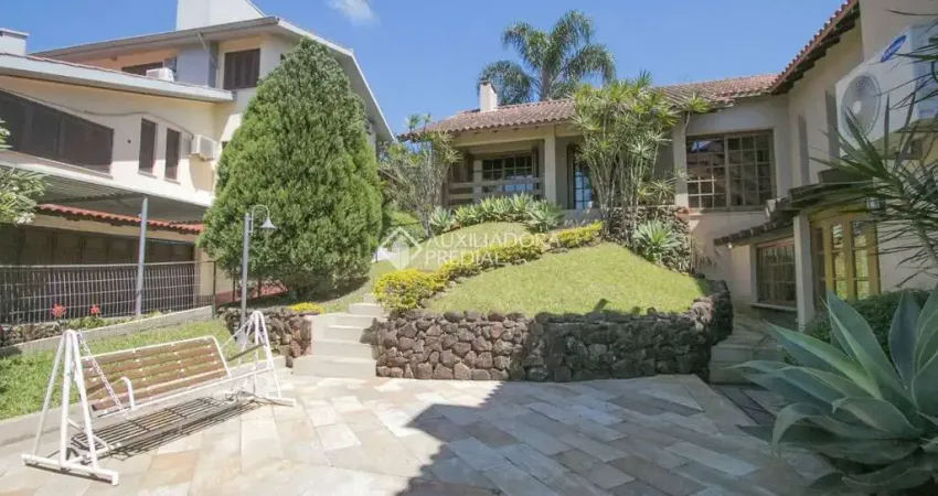 Casa em condomínio fechado com 4 quartos à venda na Avenida da Cavalhada, 5205, Cavalhada, Porto Alegre