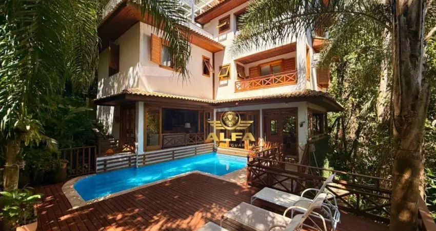 Casa de luxo à venda no condomínio iporanga, guarujá – 5 suítes, piscina, gourmet e natureza exclusiva | alfa imóveis guarujá