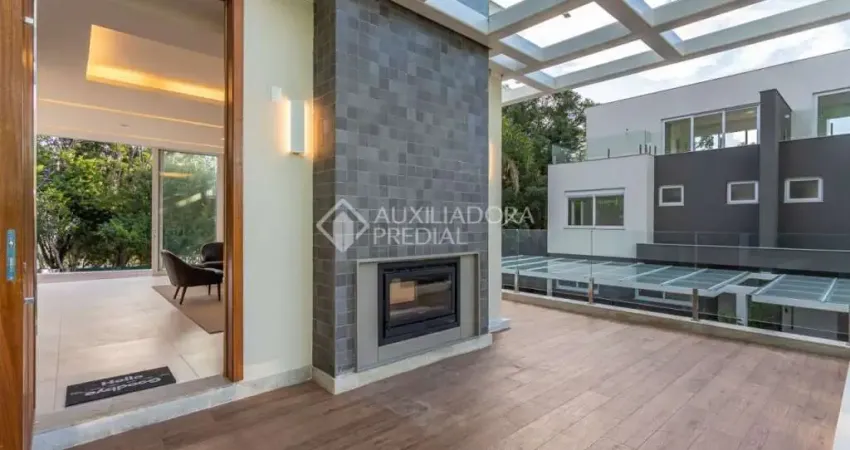 Casa em condomínio fechado com 3 quartos à venda na Rua Doutor Ney de Castilhos Ferreira, 300, Pedra Redonda, Porto Alegre