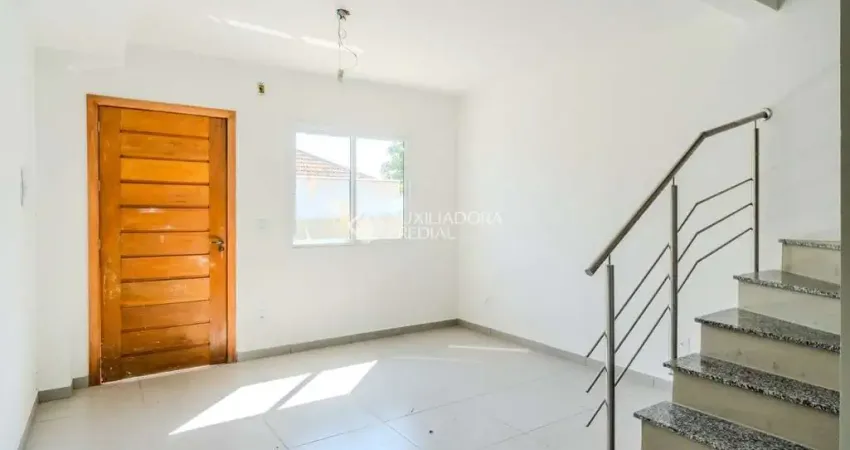 Casa em condomínio fechado com 2 quartos à venda na Rua Miguel Ascoleze, 125, Vila Nova, Porto Alegre