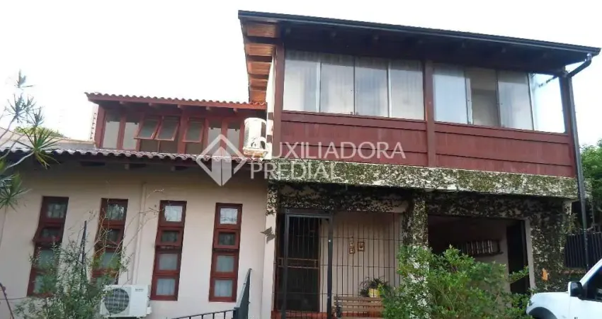 Casa em condomínio fechado com 3 quartos à venda na Avenida Guarujá, 140, Guarujá, Porto Alegre