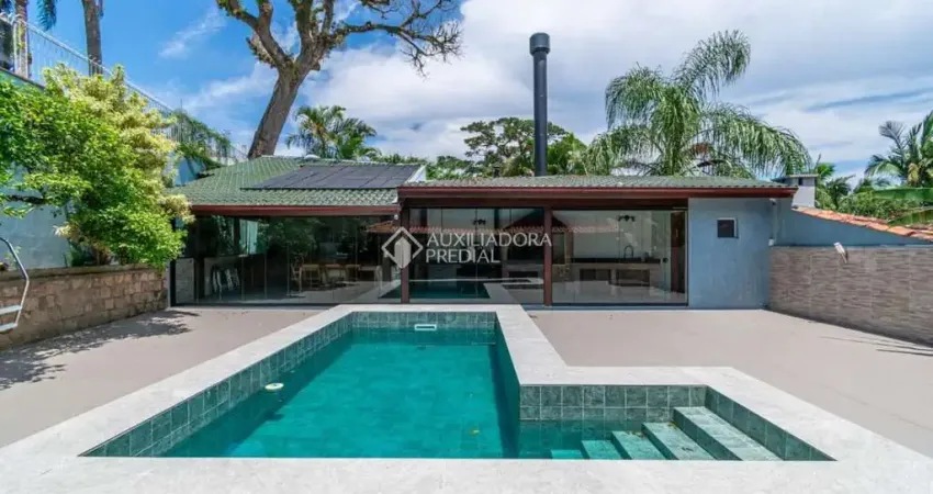 Casa em condomínio fechado com 4 quartos à venda na Rua Manoel Cabeda Perez, 63, Jardim Isabel, Porto Alegre