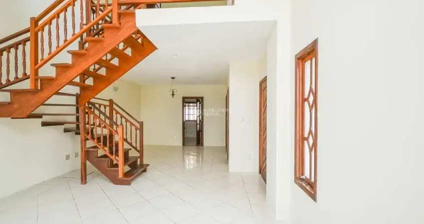 Casa em condomínio fechado com 3 quartos para alugar na Avenida Vicente Monteggia, 1020, Cavalhada, Porto Alegre