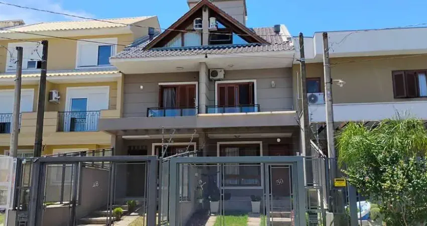 Casa com 3 quartos à venda na Rua Nestor José Nitschke, Guarujá, Porto Alegre