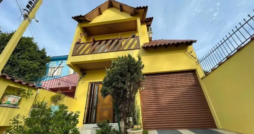 Casa com 3 dormitórios à venda, 165 m² por R$ 520.000,00 - Medianeira - Porto Al