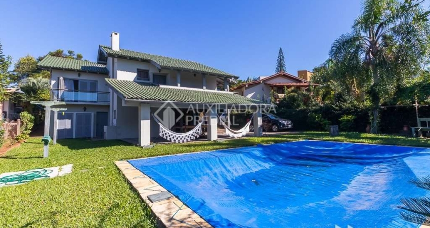 Casa em condomínio fechado com 3 quartos à venda na Avenida Firmino Octávio Bimbi, 255, Cavalhada, Porto Alegre