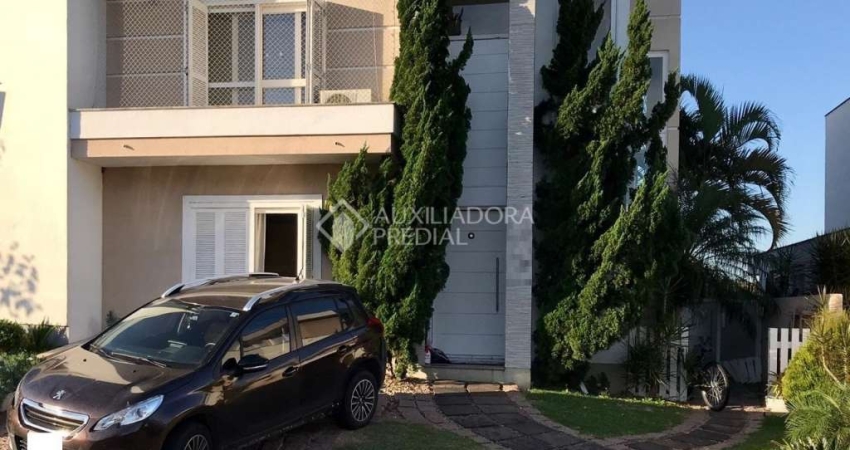 Casa em condomínio fechado com 4 quartos à venda na Avenida Edgar Pires de Castro, 540, Campo Novo, Porto Alegre