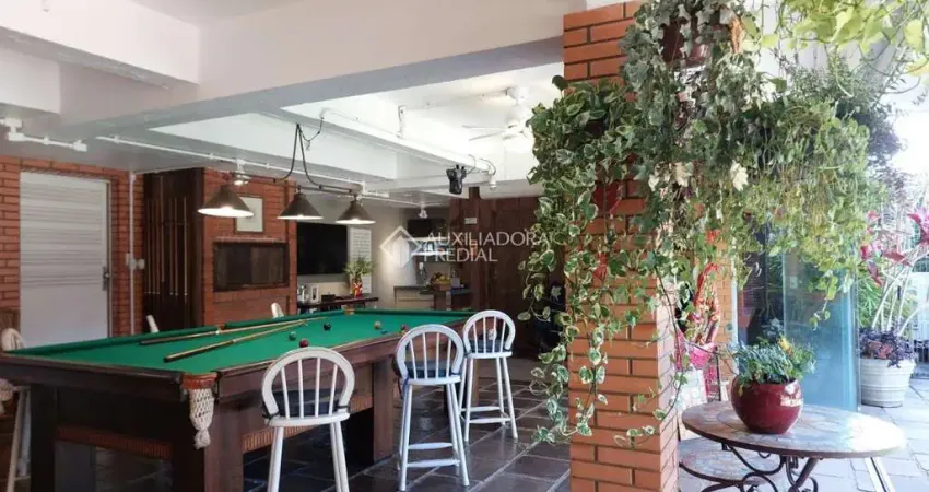 Casa em condomínio fechado com 3 quartos à venda na Rua Inhanduí, 252, Cristal, Porto Alegre