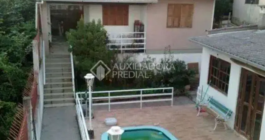 Casa com 3 quartos à venda na Rua Ângelo Passuelo, 330, Vila Nova, Porto Alegre