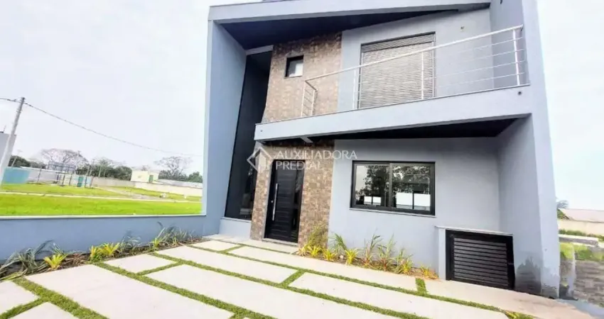 Casa em condomínio fechado com 3 quartos à venda na Avenida Juca Batista, 5505, Hípica, Porto Alegre