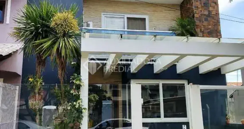 Casa em condomínio fechado com 3 quartos à venda na Rua Guatambu, 271, Hípica, Porto Alegre