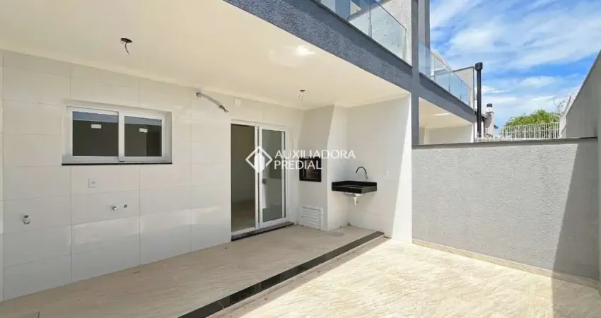 Casa em condomínio fechado com 3 quartos à venda na Rua Guatambu, 467, Hípica, Porto Alegre