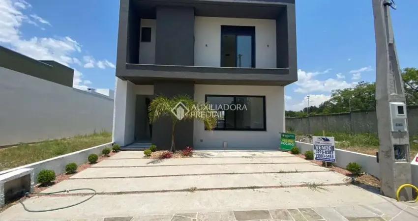 Casa em condomínio fechado com 3 quartos à venda na Avenida Juca Batista, 5505, Hípica, Porto Alegre