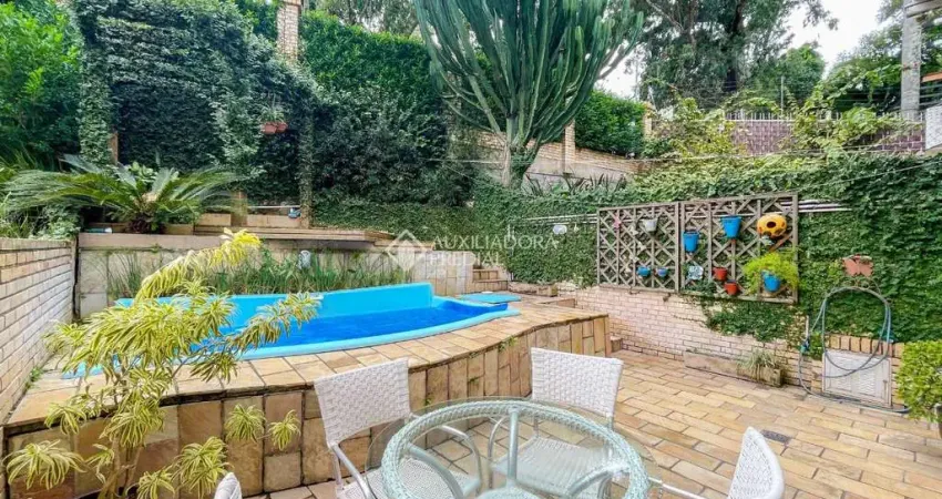 Casa em condomínio fechado com 4 quartos à venda na Rua Professor Xavier Simões, 495, Sétimo Céu, Porto Alegre