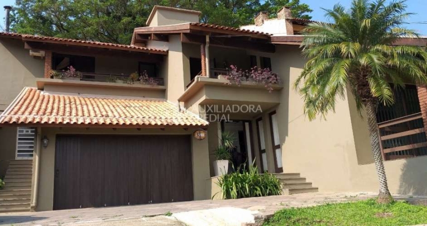 Casa em condomínio fechado com 3 quartos à venda na Rua Edgar Luiz Schneider, 510, Jardim Isabel, Porto Alegre