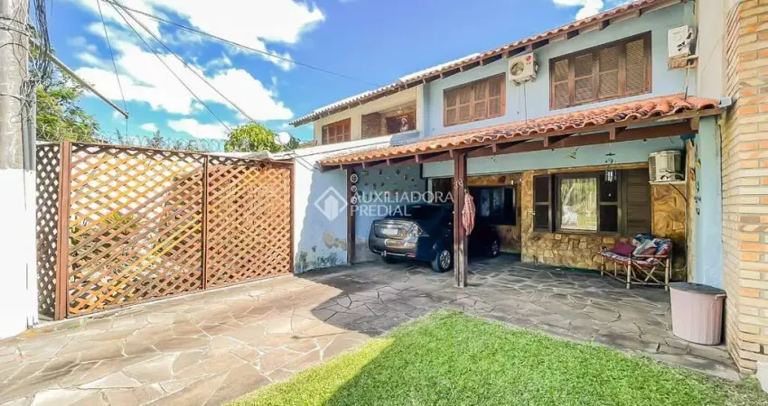Casa em condomínio fechado com 3 quartos à venda na Avenida Juca Batista, 1490, Cavalhada, Porto Alegre
