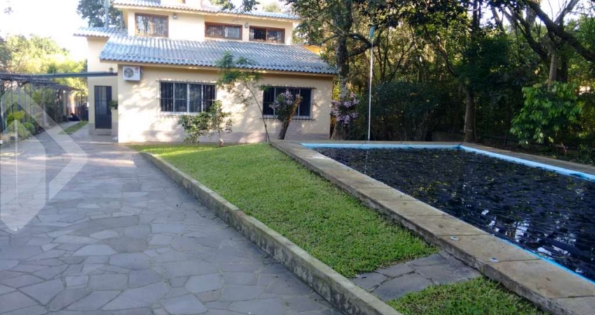 Casa em condomínio fechado com 3 quartos à venda na Rua Doutor Cecílio Monza, 10662, Belém Novo, Porto Alegre