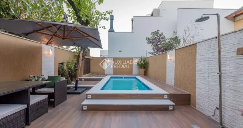 Casa em condomínio fechado com 3 quartos à venda na Rua Goitacaz, 606, Vila Assunção, Porto Alegre