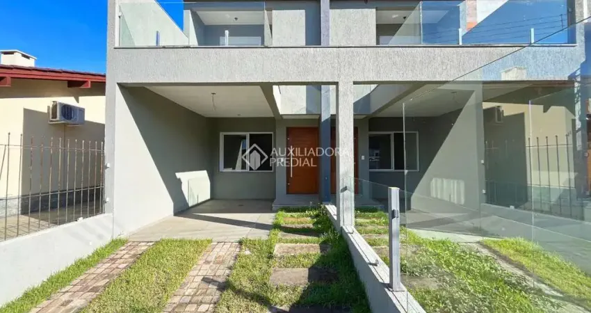 Casa com 3 quartos à venda na Rua Itacyr Rossi, 31, Guarujá, Porto Alegre