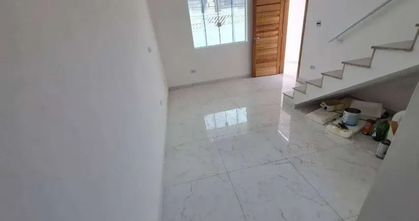 Sobrado com 3 dormitórios à venda, 104 m² por R$ 635.000,00 - Tude Bastos - Praia Grande/SP