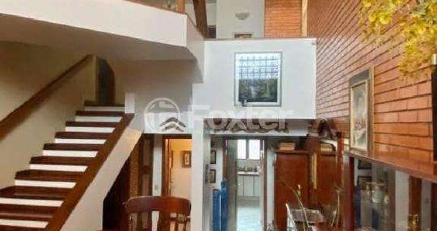 Casa em condomínio fechado com 3 quartos à venda na Avenida Jacuí, 978, Cristal, Porto Alegre