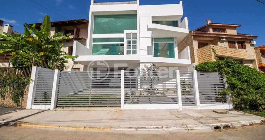 Casa em condomínio fechado com 3 quartos à venda na Rua Alcebíades Antônio dos Santos, 605, Nonoai, Porto Alegre