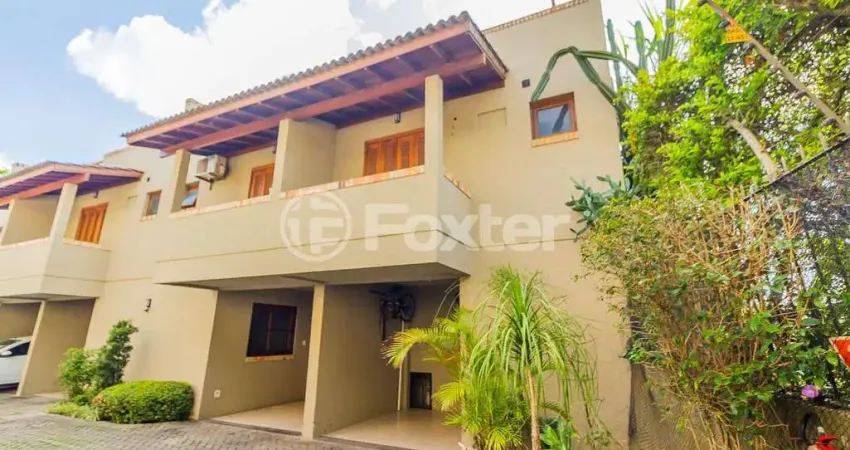 Casa em condomínio fechado com 3 quartos à venda na Avenida Guarujá, 126, Guarujá, Porto Alegre